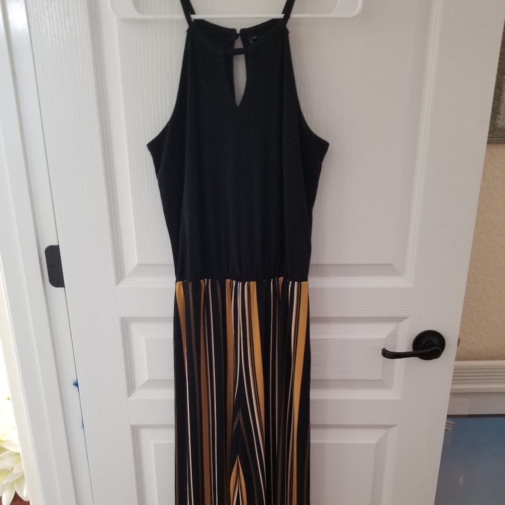 Black top and striped long jumpsuit.